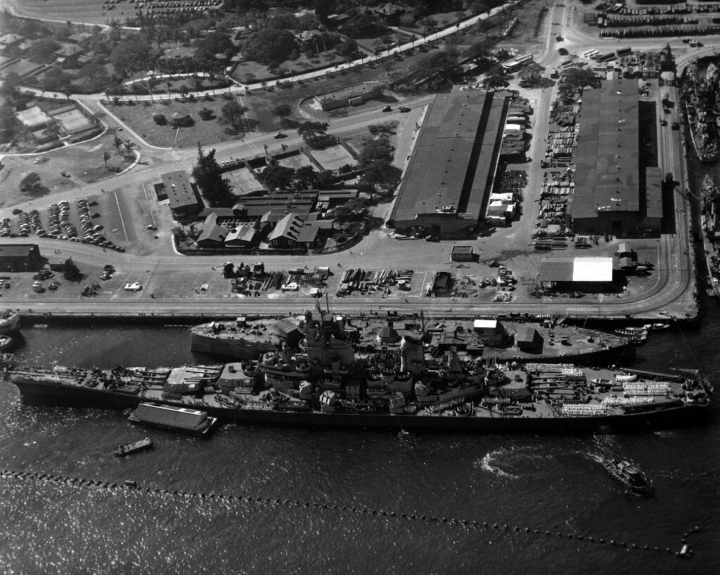 Tied up outboard of the hulk of USS Oklahoma (BB-37), at the Pearl Harbor Navy Yard next to the USS Wisconsin, 11 November 1944. U.S. Naval History and Heritage Command Photograph.